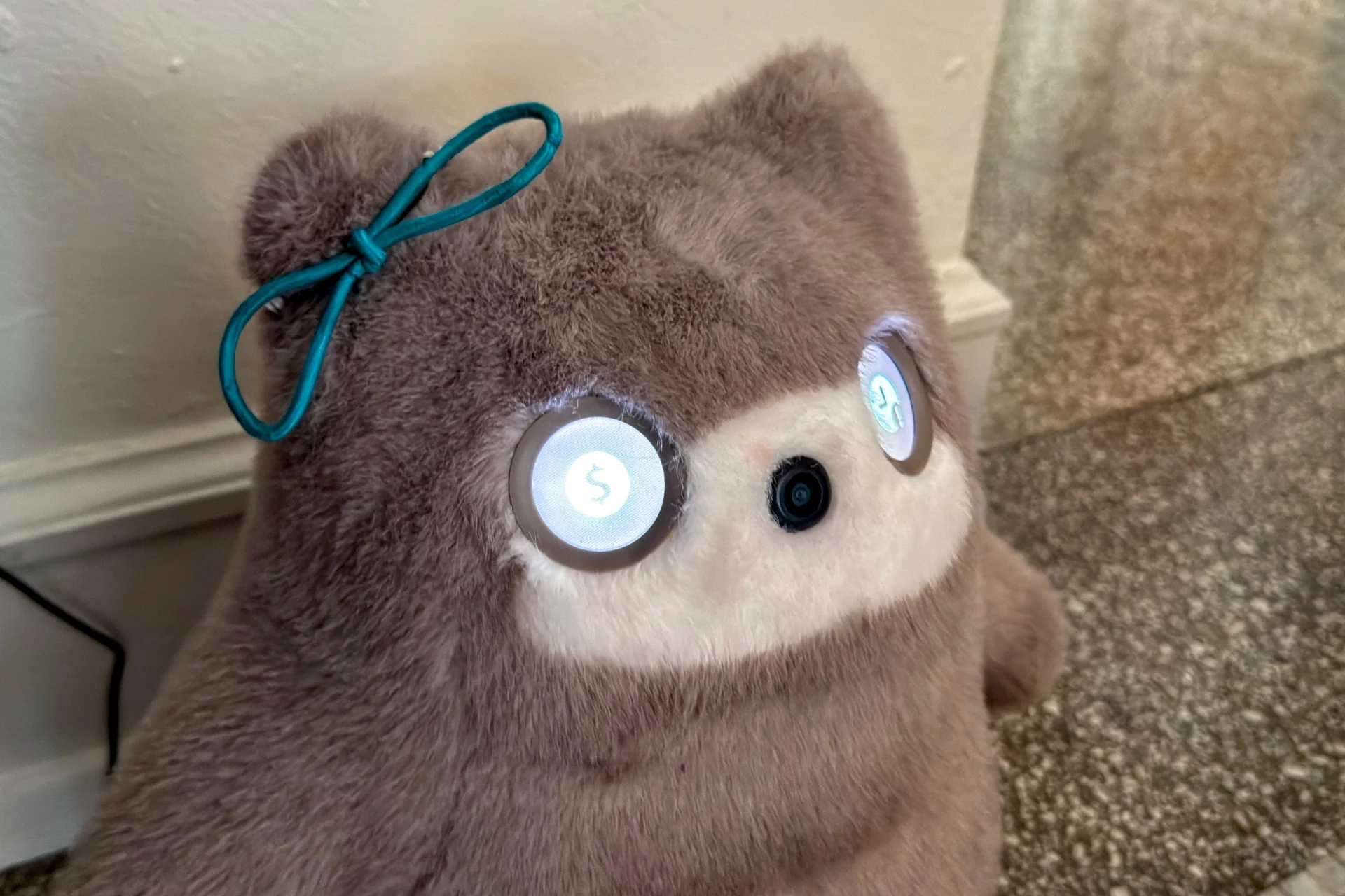 The SwitchBot Kata Friends showing a dollar sign in one eye and a clock graphic in the other, signifying that its subscription has ended.
