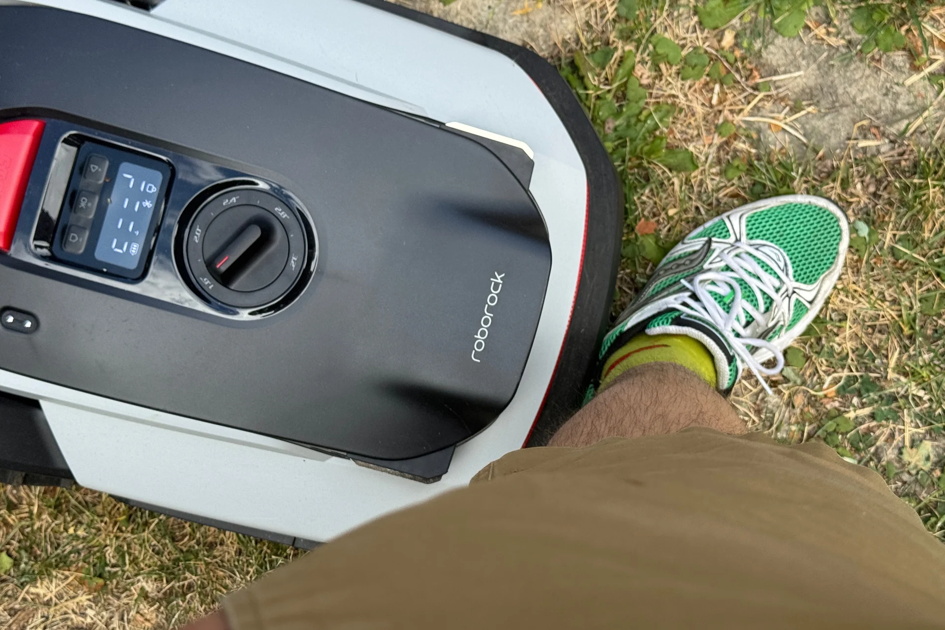 Image showing the Roborock Rockneo Q110 having bumped into a leg.