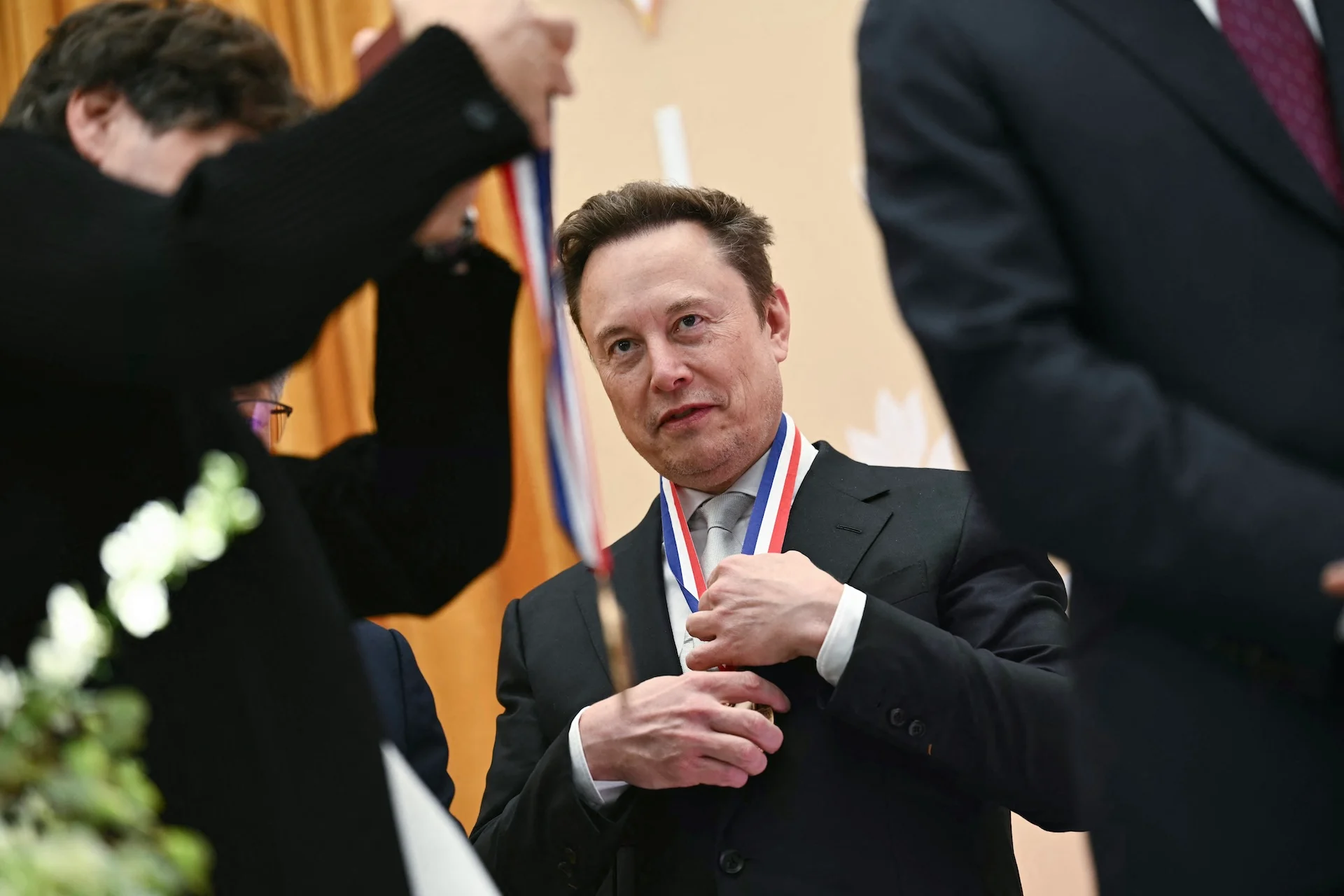 Elon Musk reacts after being awarded the National Medal of Science during the "Golden Age of American Innovation Summit" at the Institute of Peace in Washington, DC, on October 8, 2026.